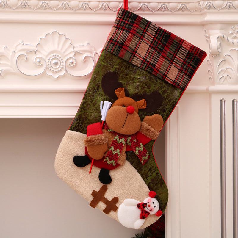 Christmas stocking decoration with reindeer and snowman design hanging on mantel for Christmas decorations