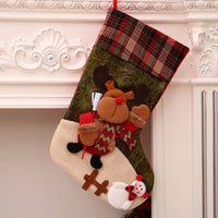 Christmas stocking decoration with reindeer and snowman design hanging on mantel for Christmas decorations