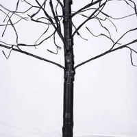 Black Halloween spooky tree with bare, twisted branches wrapped in black vinyl material