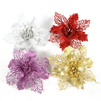 Glittery hollowed-out Christmas flower decorations in red, gold, white, and purple for Christmas decoration canes.