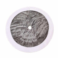 Gray and white plush Christmas tree skirt with "It's the most wonderful time of the year" embroidery