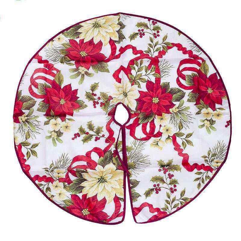 Christmas tree skirt with red and white poinsettia and holly design on white fabric