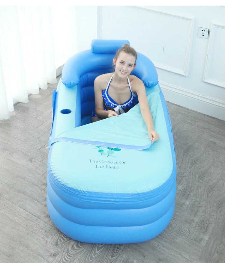 woman relaxing in blue folding inflatable bathtub with backrest and cover indoors