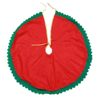 Red and green Christmas tree skirt with scalloped edges and tie closure