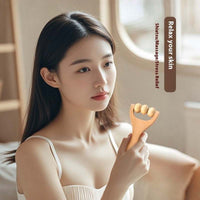 Woman using wooden portable roller foot meridian massage with three beads for stress relief and skin relaxation