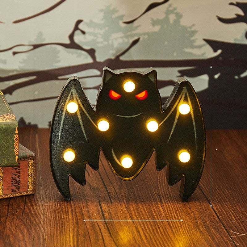 Halloween costume lights featuring a battery-powered purple bat-shaped LED decoration for indoor and outdoor use