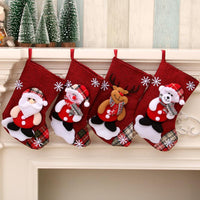 Multicolor Christmas gift bag hanging socks with Santa, snowman, reindeer, and bear designs on red plaid background