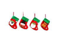 Set of red and green Christmas decorations socks with Santa, snowman, reindeer, and bear designs hanging with loops