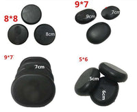 Natural black stone set for massage spa with various sizes for bathing and relaxation