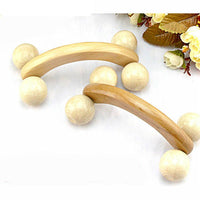 Wooden roller massager with curved handle and four rotating massage wheels for muscle relaxation and pain relief
