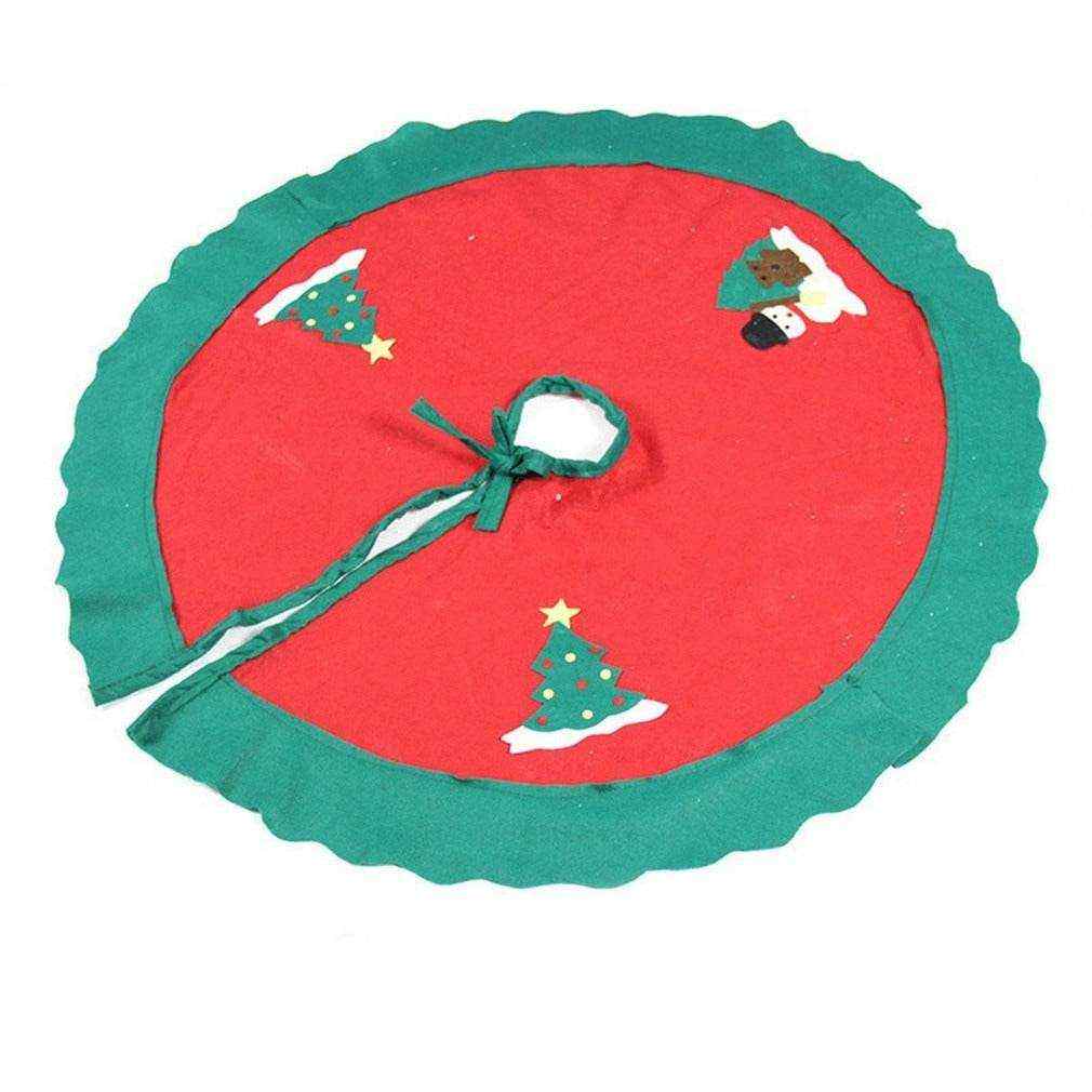 Red and green Christmas tree skirt with festive holiday decorations and tie string closure
