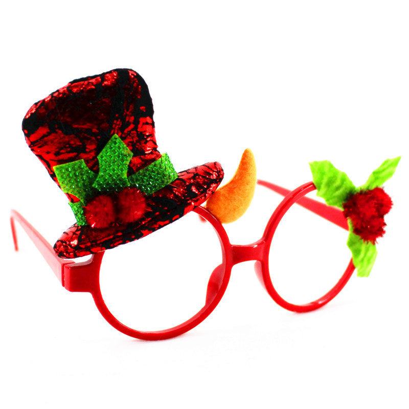 Red Christmas glasses frame with festive hat and holiday decorations