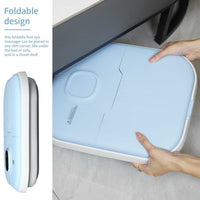 Foldable electric collapsible foot spa massager in light blue for easy storage under furniture