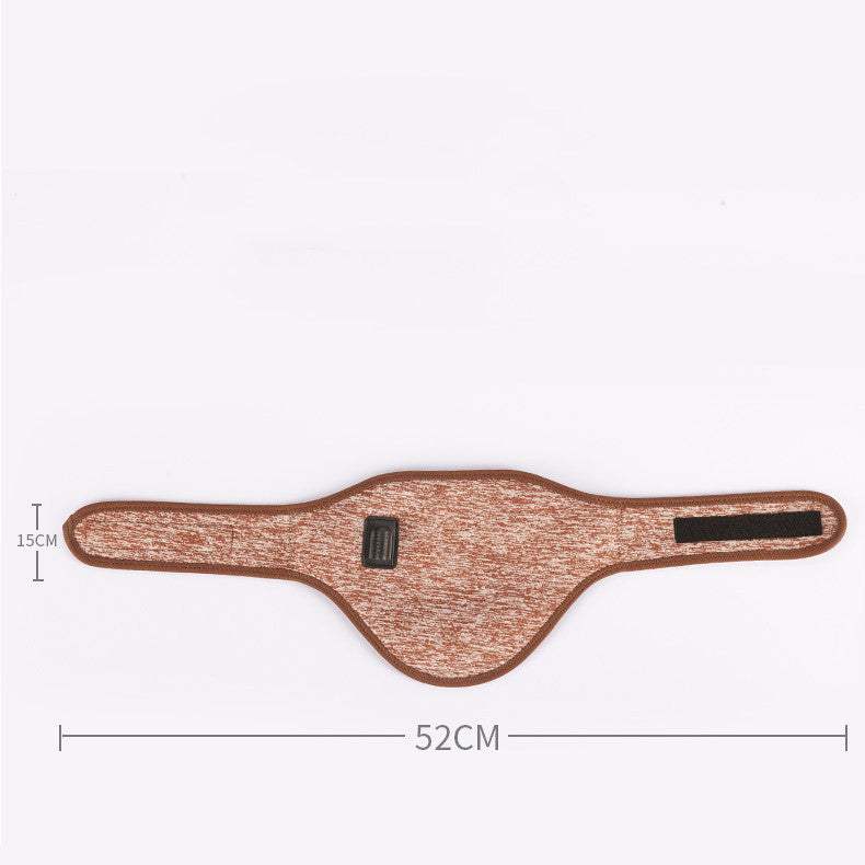 Woman wearing electric heating neck massage belt with USB power plug on beige background