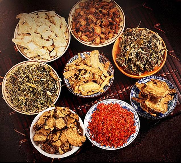 Various dried herbs in bowls for foot bath foot bag use