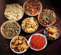 Various dried herbs in bowls for foot bath foot bag use