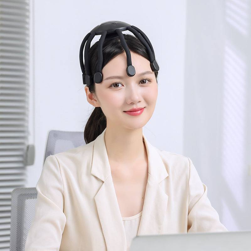 Woman wearing black USB-powered vibrating head massager with eight claws for scalp relaxation