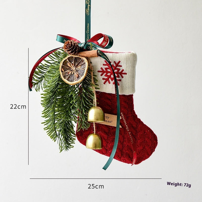 Festive knitted stockings Christmas Decoration hanging by fireplace