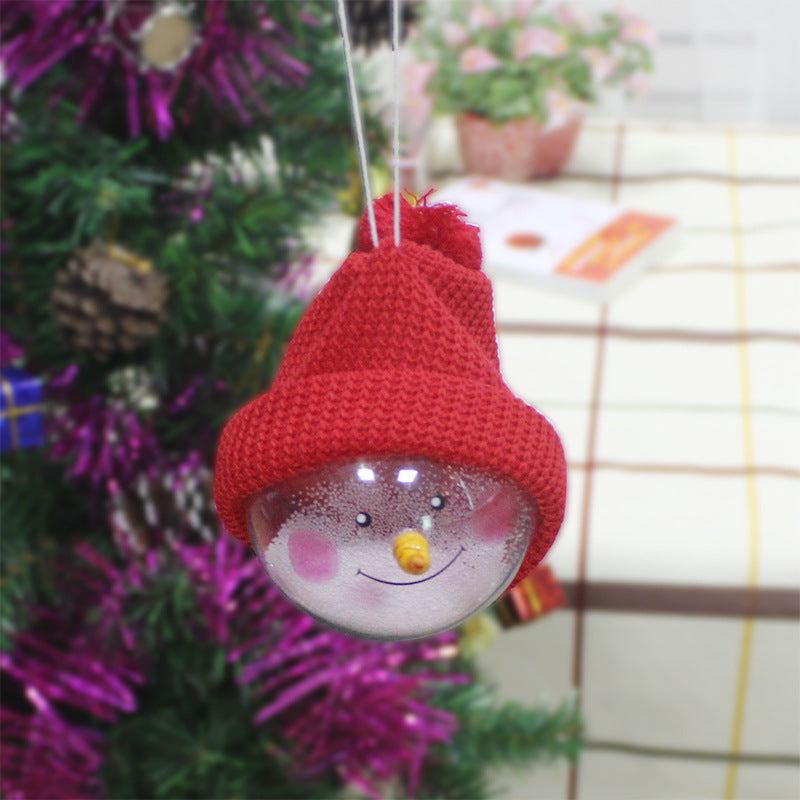 Christmas decorations snowman ornament plastic ball with red knitted hat hanging on tree