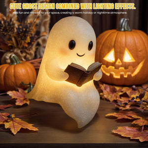 Cute ghost night light with warm LED glow holding a book, perfect for Halloween decorations and children's bedside lamp.