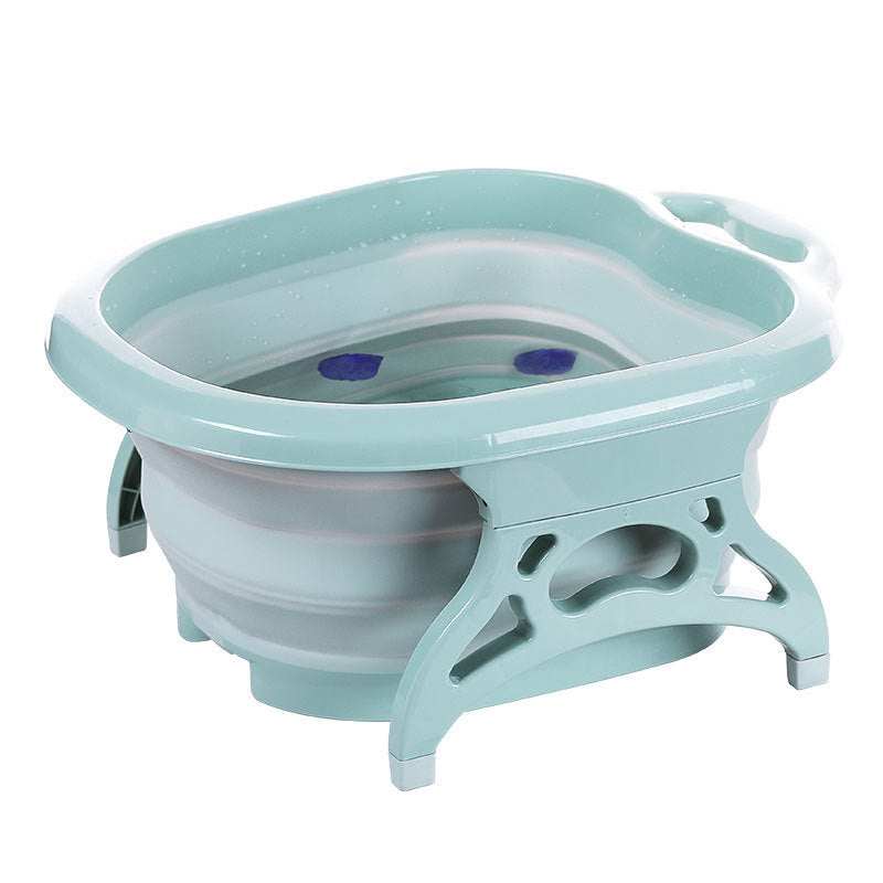 Foldable green plastic footbath with massage balls and collapsible design for easy storage