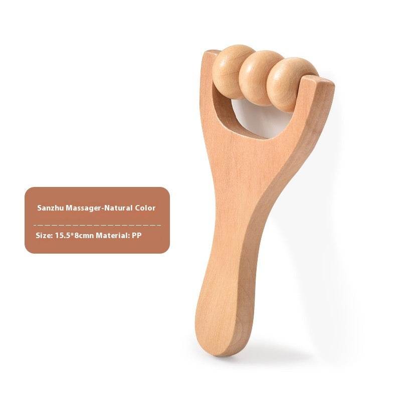 Woman using wooden portable roller foot meridian massage with three beads for stress relief and skin relaxation