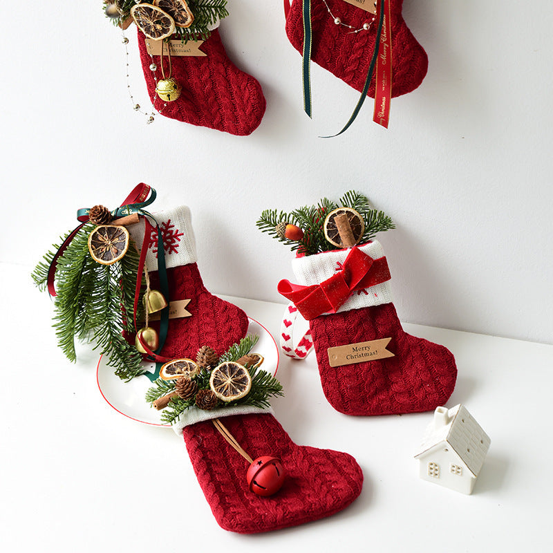 Festive knitted stockings Christmas Decoration hanging by fireplace