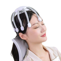 Woman using white and gray eight-claw vibrating head massager for scalp relaxation
