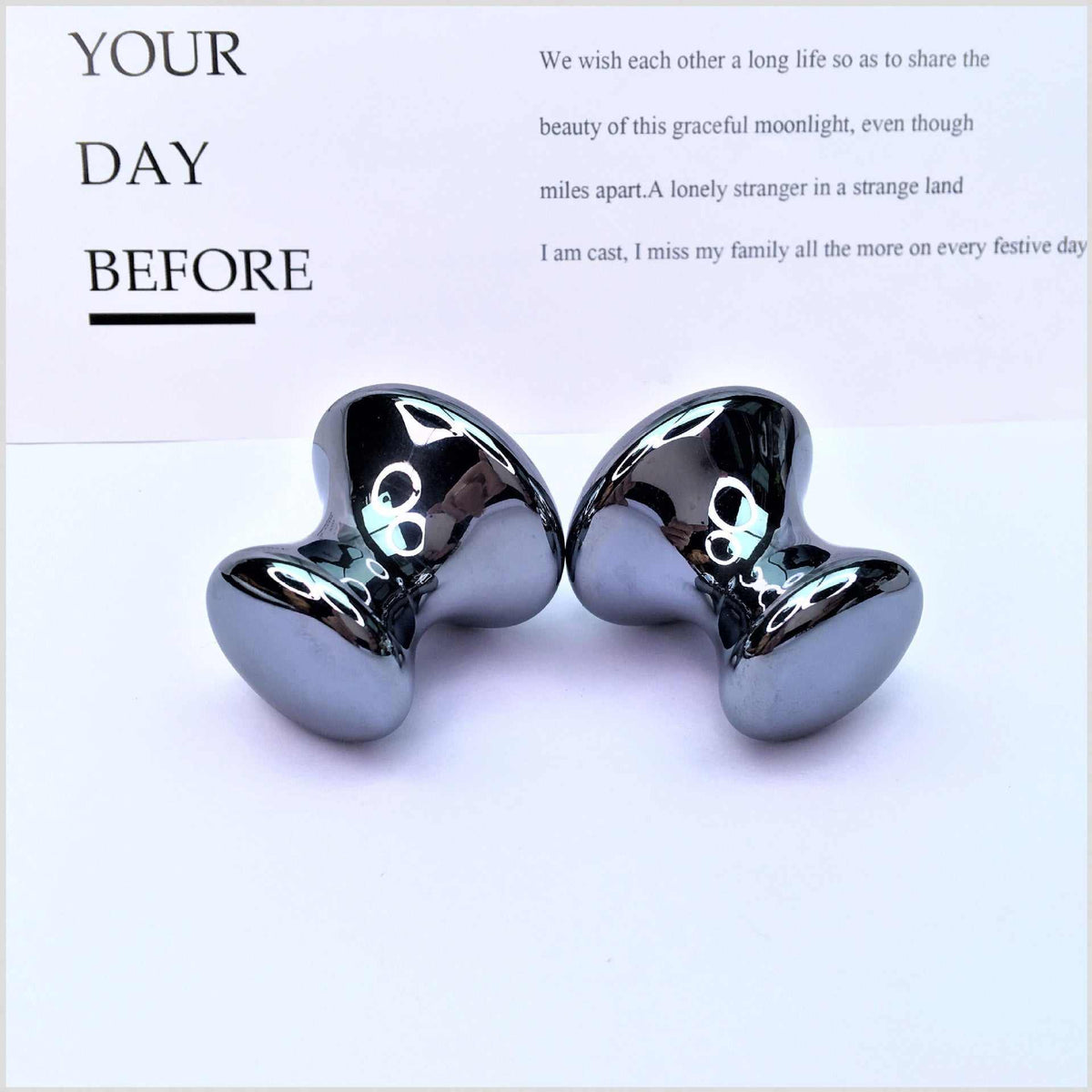 Quantum Stone Terahertz mushroom-shaped handheld massager in metallic finish for relaxing massage