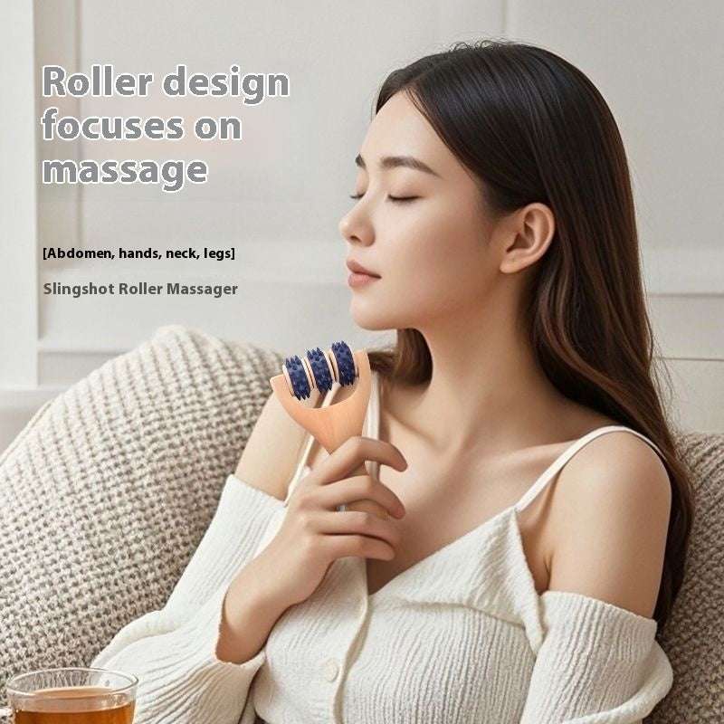 Woman using wooden portable roller foot meridian massage with three beads for stress relief and skin relaxation