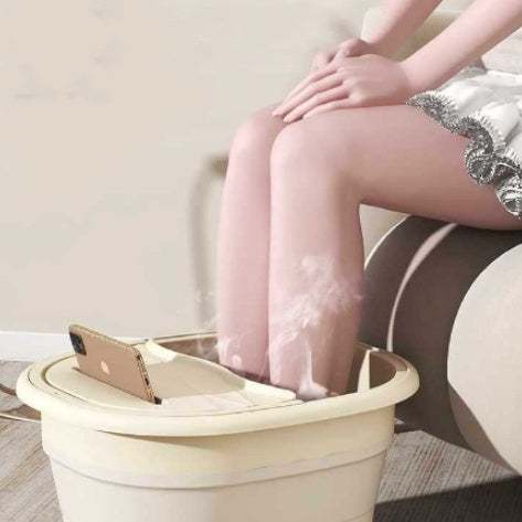 Portable foot bath tub in cream white with cover, thick pleated massage design, used for home foot soaking and relaxation