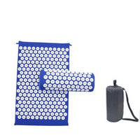 Blue acupuncture massage mat and pillow set with white acupressure points and black storage bag