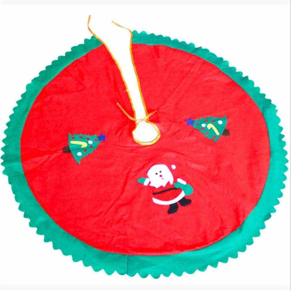 Christmas tree skirt with Santa and tree decorations in red and green fabric