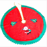 Christmas tree skirt with Santa and tree decorations in red and green fabric