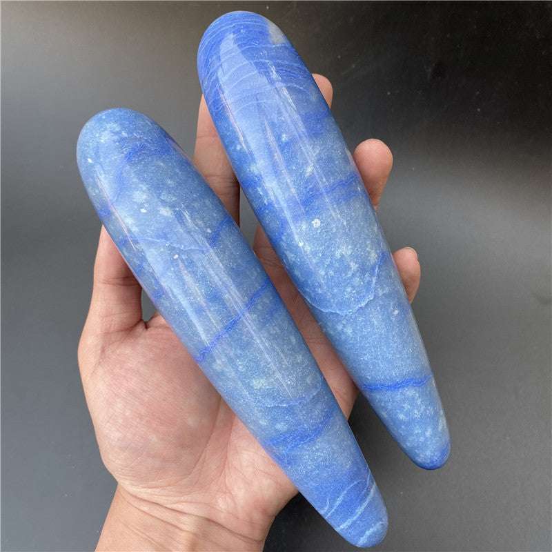 Natural blue carved polished stone massage sticks in hand natural stone therapy tools
