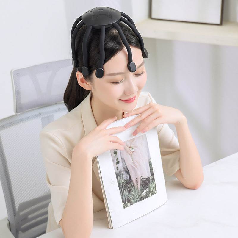 Woman relaxing at desk using vibrating head massager with eight claws for scalp massage
