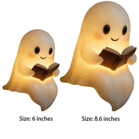 Cute ghost night light with warm LED glow holding a book, perfect for kids' bedside or Halloween decor