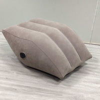 Home Artifact Inflatable gray PVC wedge leg pillow with flocking surface and air valve on wooden floor