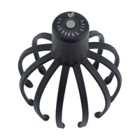 Black electric scalp massager with 12 flexible TPE massage arms and USB charging button on top