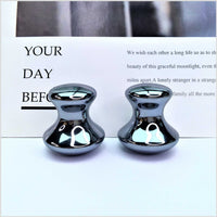 Quantum Stone Terahertz mushroom head massager pair with reflective metallic finish for massage therapy