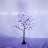 Lighted black Halloween spooky tree with glowing purple LED lights and adjustable branches