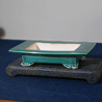 Japanese style green ceramic basin with cloud foot design on wooden stand