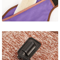 Woman wearing electric heating neck massage belt with USB power plug on beige background