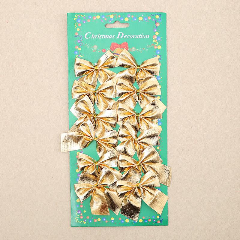 Gold Christmas tree ornament bows on green card packaging
