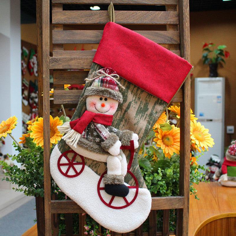 Christmas decorations Santa Claus socks hanging on wooden frame with flowers background