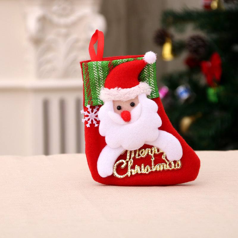 Red Santa Claus Christmas stocking decoration with "Merry Christmas" embroidery and green top trim