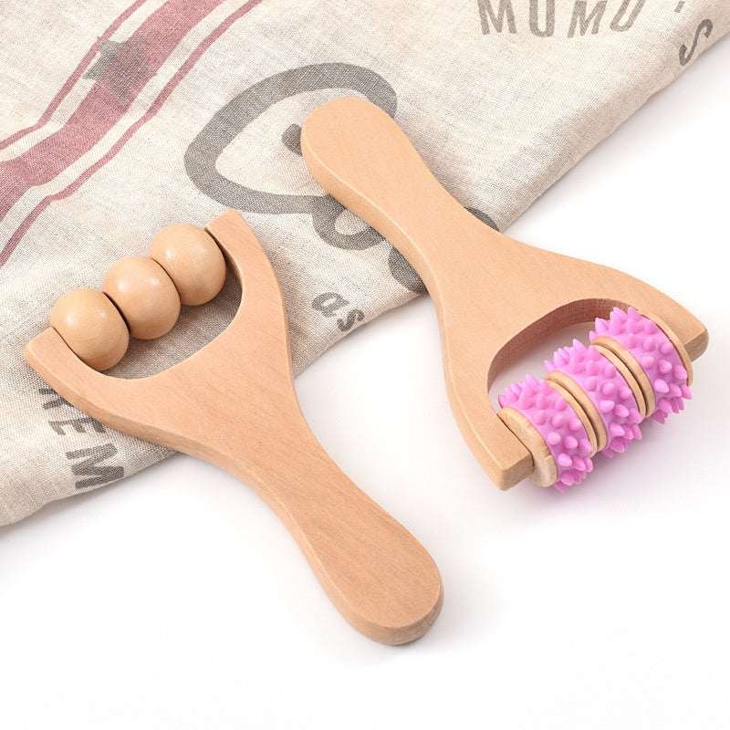 Woman using wooden portable roller foot meridian massage with three beads for stress relief and skin relaxation