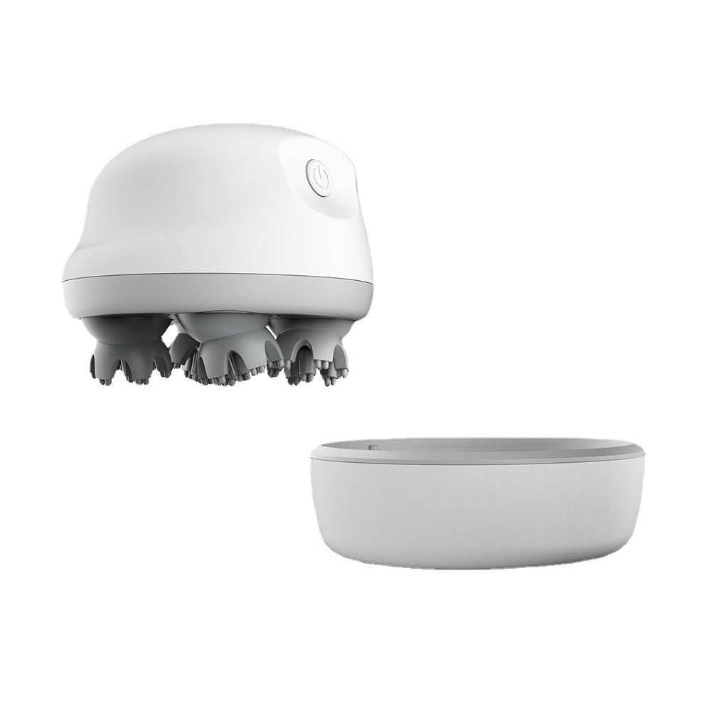 Compact white electric head massager with kneading silicone scalp attachments and charging base